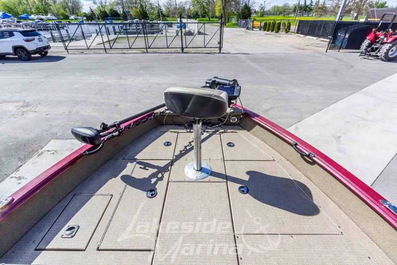 Slide: The Image of 2020 G3 Angler V19 FS boat deck with seating and equipment, parked outdoors. - 23