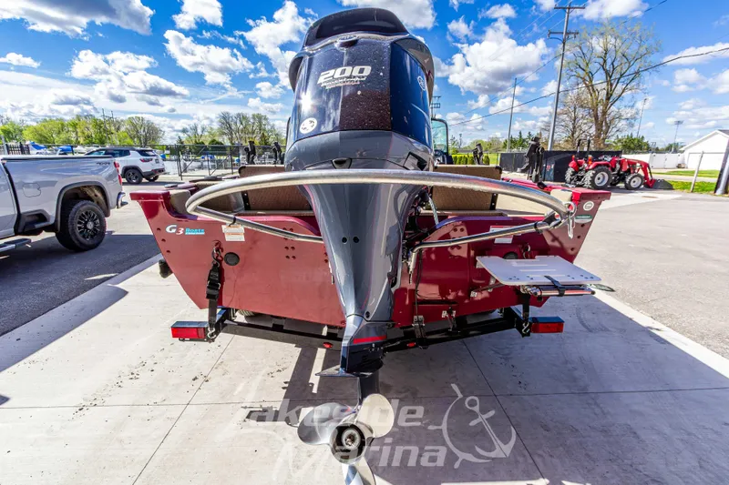 Slide: The Image of 2020 G3 Angler V19 FS boat with powerful outboard motor in a marina setting. - 5