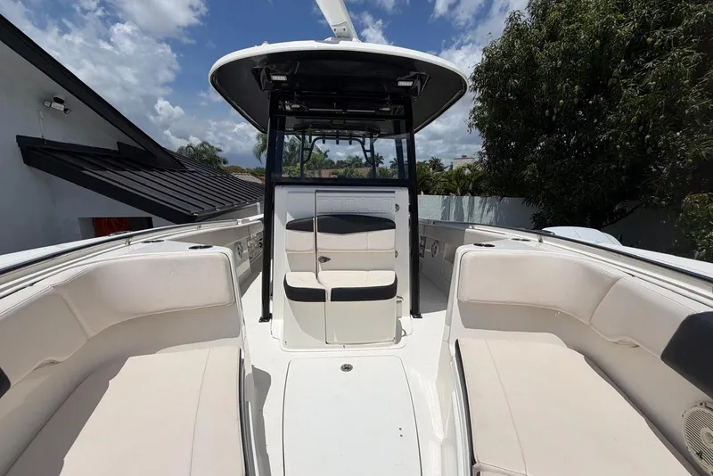 Slide: The Image of 2017 Robalo R302 Center Console boat with spacious seating and sleek design. - 11