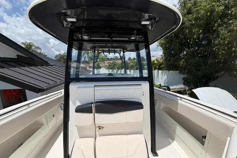 Slide: The Image of 2017 Robalo R302 Center Console boat interior with seating and console view. - 12