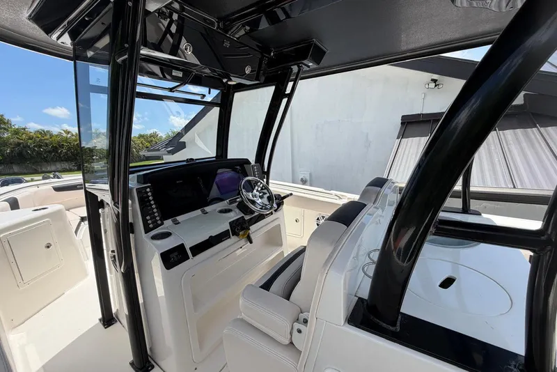 Slide: The Image of 2017 Robalo R302 Center Console boat interior with modern helm and seating. - 19