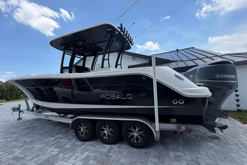 Slide: The Image of 2017 Robalo R302 Center Console boat on trailer with Yamaha engines. - 6