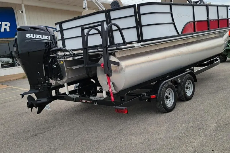 Slide: The Image of 2023 Bentley Pontoons 200 Fish with Suzuki outboard motor on a trailer. - 2