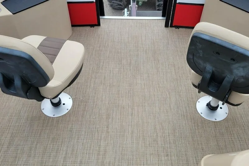Slide: The Image of 2023 Bentley Pontoons 200 Fish interior with beige seats and carpet flooring. - 3