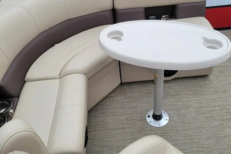 Slide: The Image of 2023 Bentley Pontoons 200 Fish interior with beige seating and round table. - 4