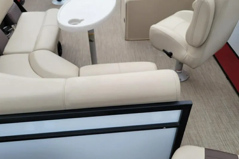 Slide: The Image of 2023 Bentley Pontoons 200 Fish interior with beige seating and table. - 5