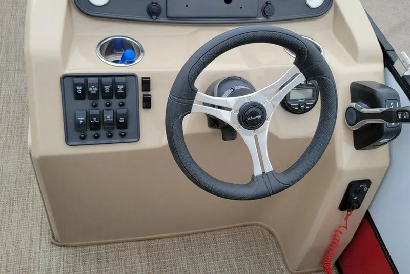 Slide: The Image of 2023 Bentley Pontoons 200 Fish steering console with controls and switches. - 8
