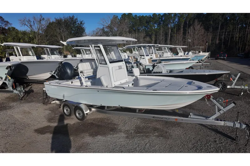 The Image of 2026 Sea Fox 231 Bay Fox boat on trailer, parked among similar vessels. - 0