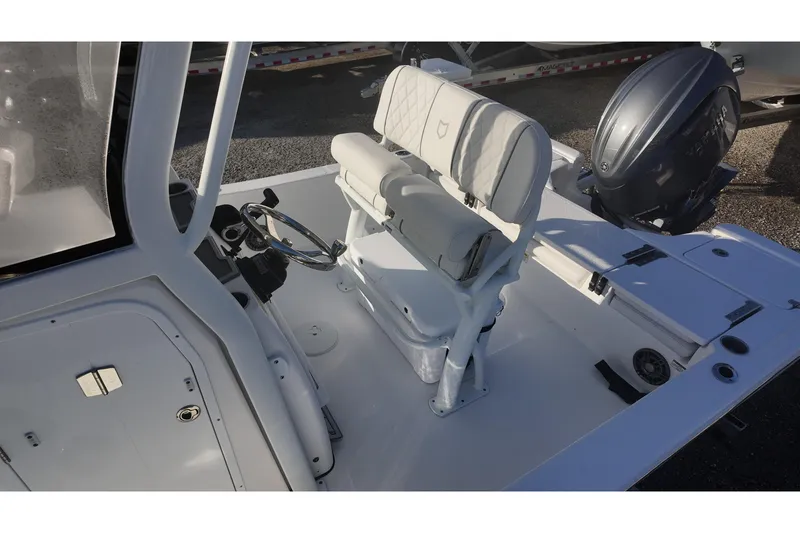 Slide: The Image of 2026 Sea Fox 231 Bay Fox boat interior with steering wheel and seating. - 11