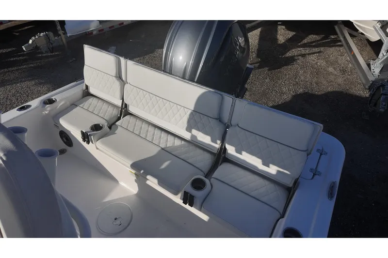 Slide: The Image of 2026 Sea Fox 231 Bay Fox boat seating area with cup holders and quilted upholstery. - 12