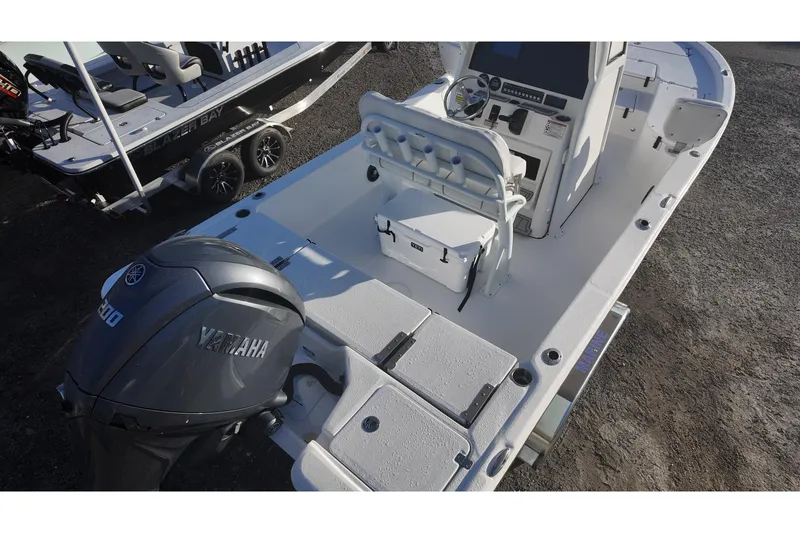 Slide: The Image of 2026 Sea Fox 231 Bay Fox boat with Yamaha engine, featuring a spacious deck and console. - 4