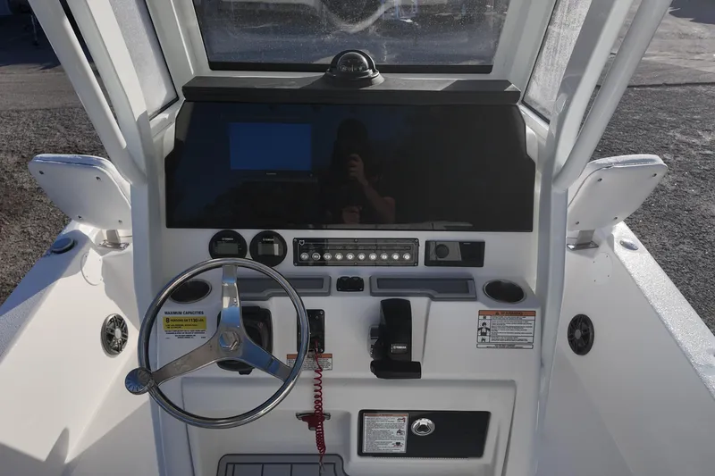 Slide: The Image of 2026 Sea Fox 231 Bay Fox boat dashboard with steering wheel and controls. - 6
