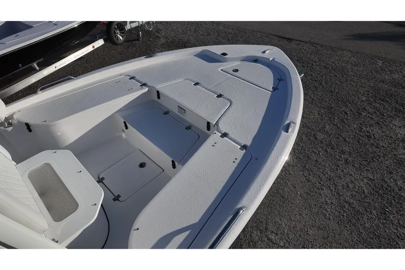 Slide: The Image of 2026 Sea Fox 231 Bay Fox boat deck with storage compartments and seating. - 7