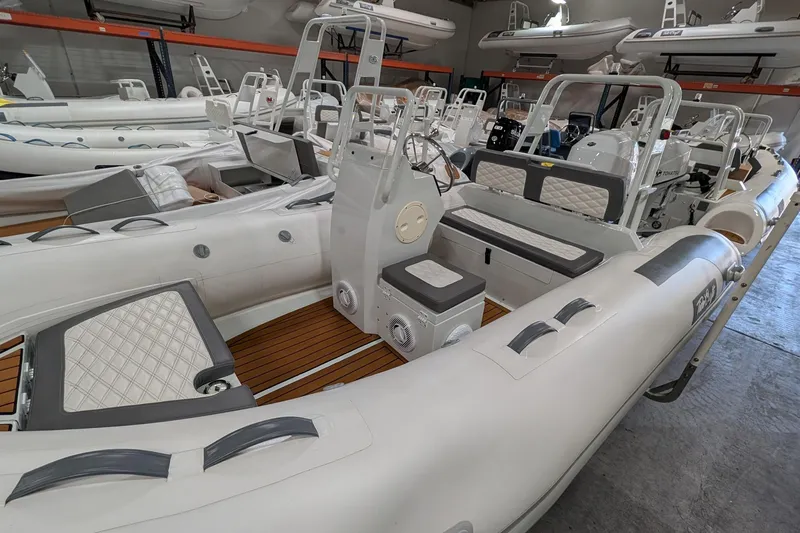 Slide: The Image of 2025 Tide Craft Catalina 13 boat with trailer, featuring sleek design and modern amenities. - 2