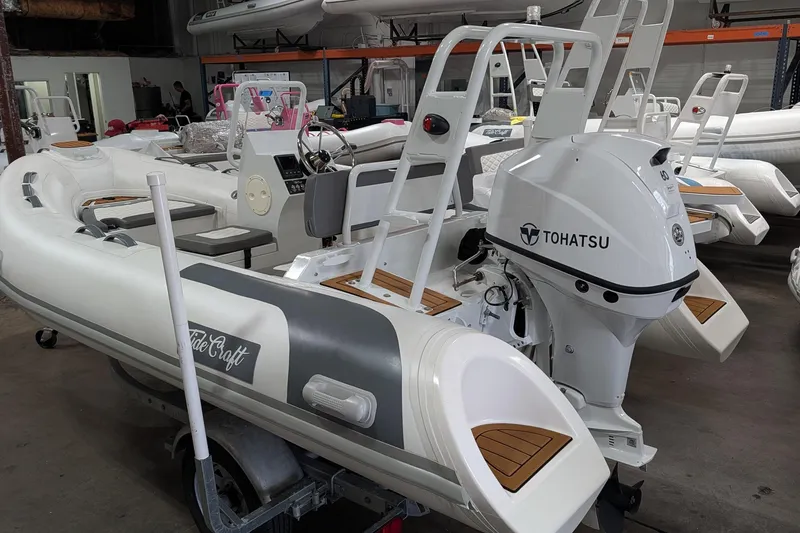 Slide: The Image of 2025 Tide Craft Catalina 13 boat with Tohatsu engine on trailer in showroom. - 7