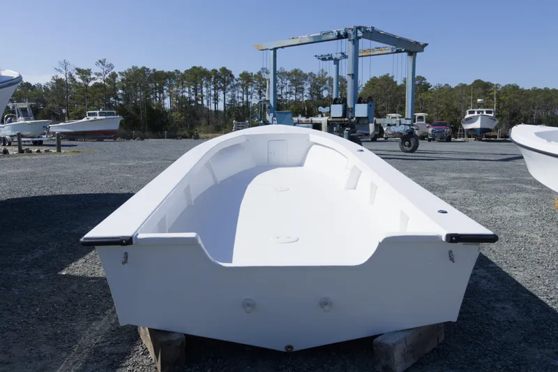 Slide: The Image of 2026 C-Hawk 23 Center Console boat on display in a marina setting. - 3