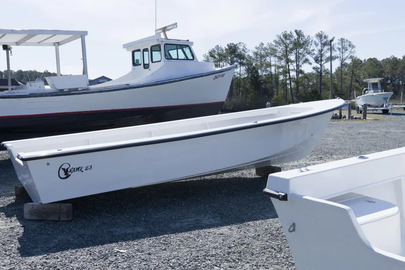 Slide: The Image of 2026 C-Hawk 23 Center Console boat displayed outdoors on gravel. - 4