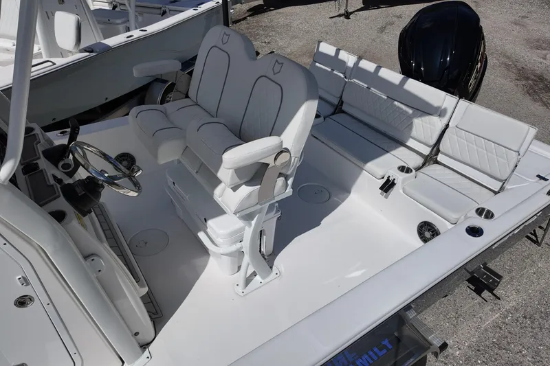 Slide: The Image of 2026 Sea Fox 251 Bay Fox boat interior with white seating and steering wheel. - 11