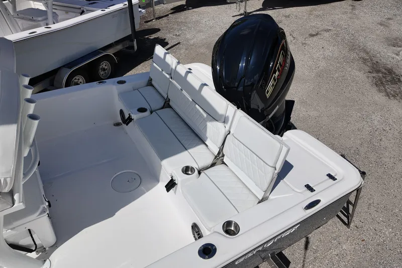 Slide: The Image of 2026 Sea Fox 251 Bay Fox boat with white seating and powerful outboard motor. - 12