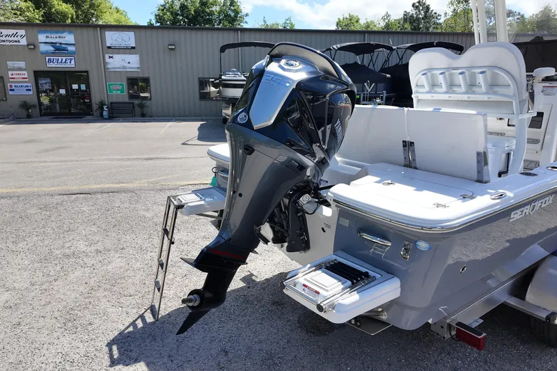 Slide: The Image of 2026 Sea Fox 251 Bay Fox boat with powerful outboard motor in dealership lot. - 14