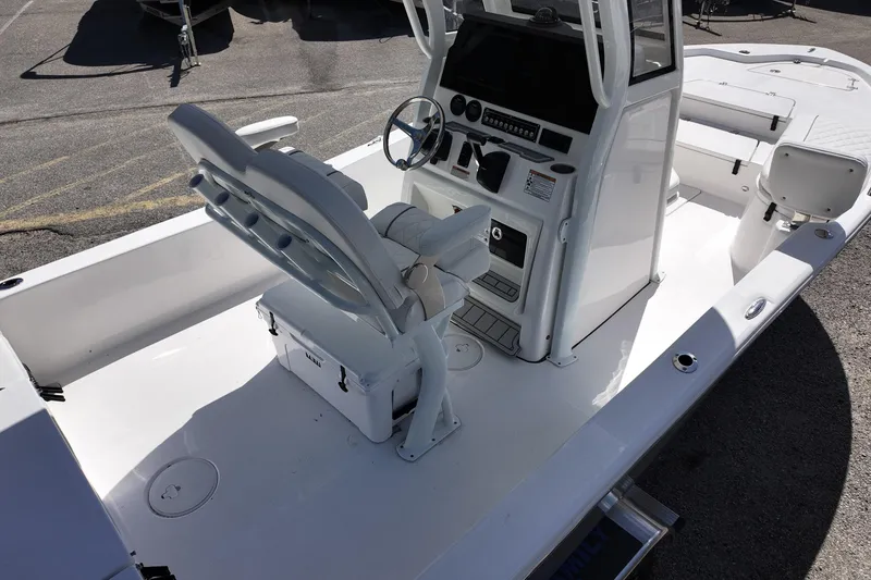 Slide: The Image of 2026 Sea Fox 251 Bay Fox boat interior with helm and seating. - 4