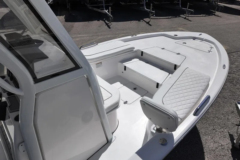 Slide: The Image of 2026 Sea Fox 251 Bay Fox boat interior with white seating and storage compartments. - 6