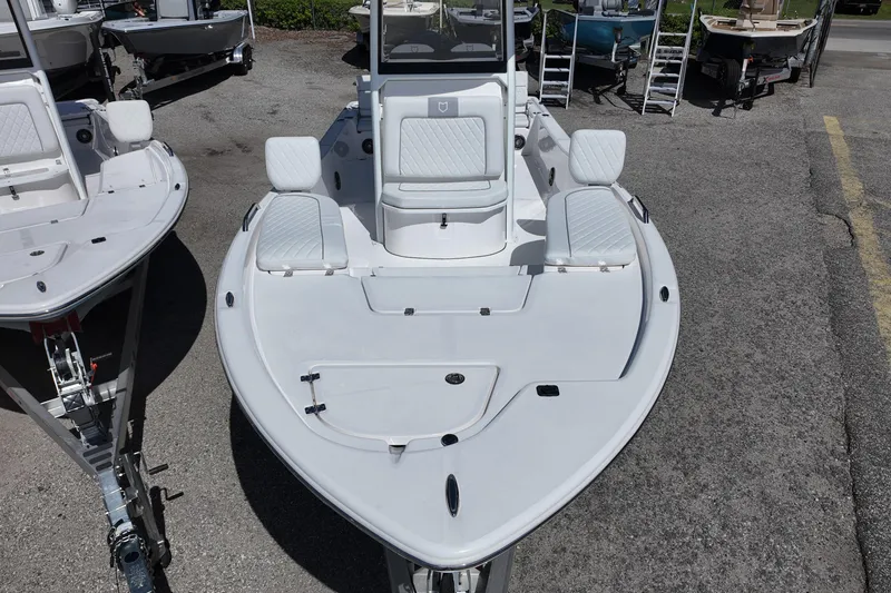 Slide: The Image of 2026 Sea Fox 251 Bay Fox boat, white deck, docked outdoors. - 7