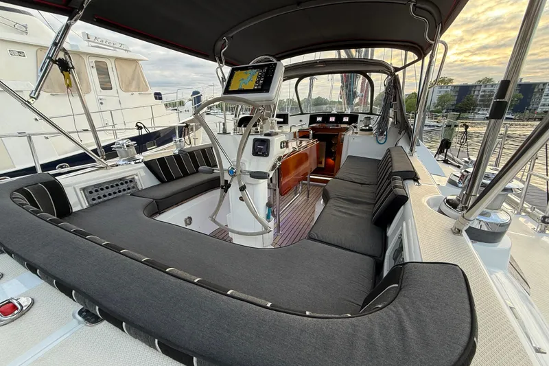 Slide: The Image of Luxurious 2014 Hylas 56 yacht cockpit with plush seating and navigation equipment. - 10