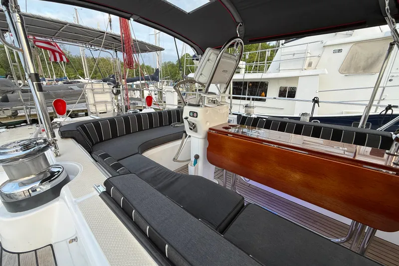 Slide: The Image of Luxurious 2014 Hylas 56 yacht cockpit with elegant seating and polished wood accents. - 11