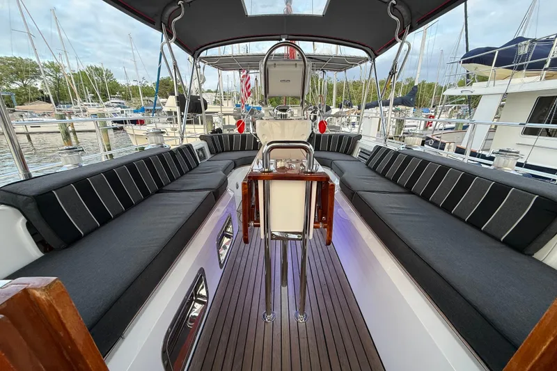 Slide: The Image of Luxurious 2014 Hylas 56 yacht cockpit with sleek seating and polished wood flooring. - 12