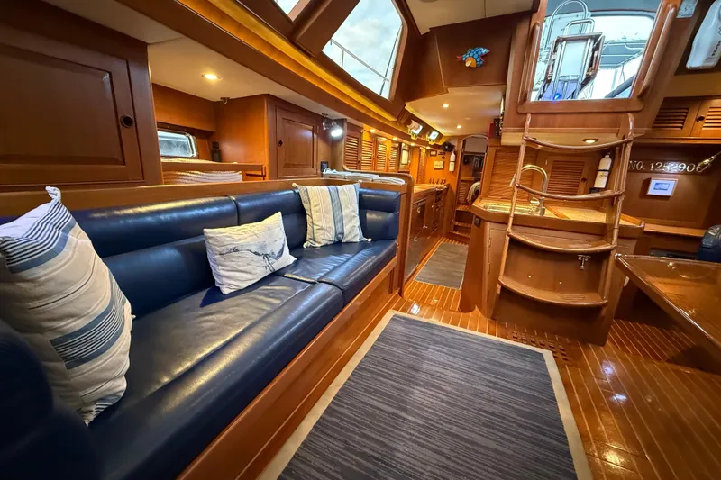 Slide: The Image of Luxurious interior of a 2014 Hylas 56 yacht with elegant wood finishes and plush seating. - 16