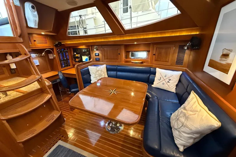 Slide: The Image of Luxurious interior of a 2014 Hylas 56 yacht with elegant wood and leather seating. - 17