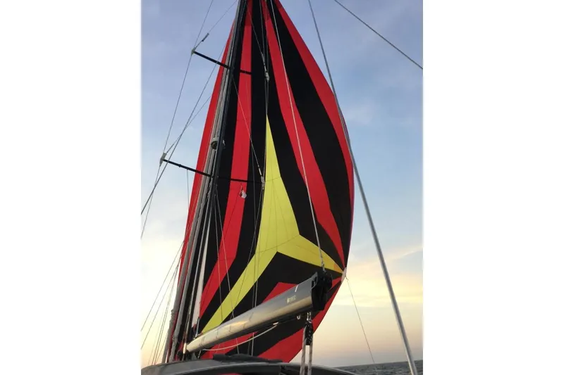 Slide: The Image of Colorful sail on a 2014 Hylas 56 yacht against a clear sky. - 30