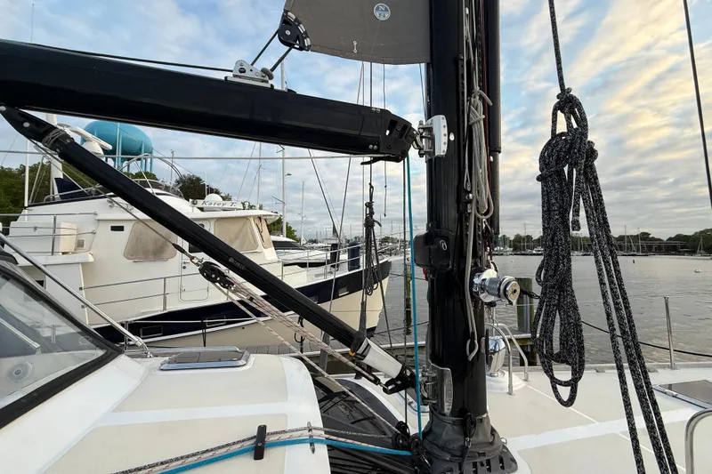 Slide: The Image of Sailboat deck view of a 2014 Hylas 56, docked with other boats nearby. - 6