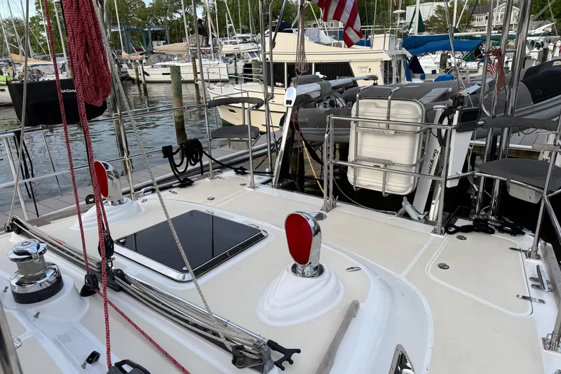 Slide: The Image of Sailboat deck of a 2014 Hylas 56, docked at a marina with other boats. - 8