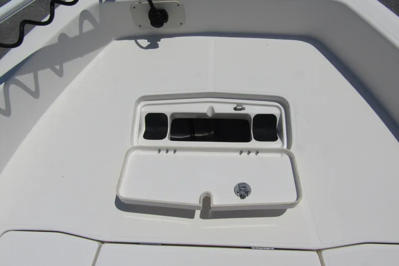 Slide: The Image of 2022 Skeeter SX2550 Fish boat deck with storage compartment open. - 12