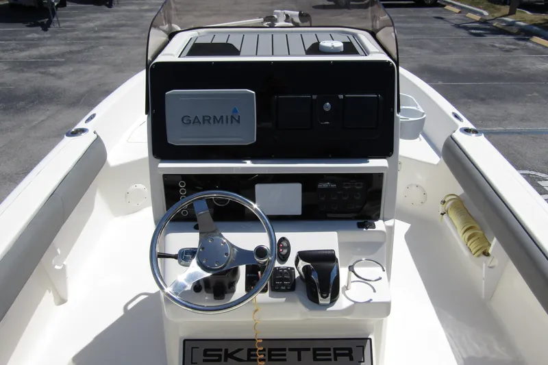 Slide: The Image of 2022 Skeeter SX2550 Fish boat console with Garmin navigation system and steering wheel. - 18