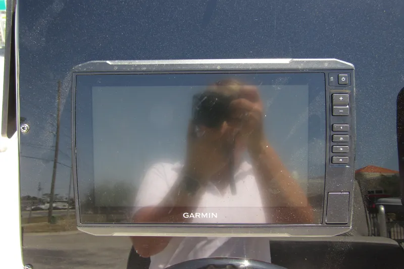 Slide: The Image of Garmin display on 2022 Skeeter SX2550 Fish boat dashboard, reflecting surroundings. - 19