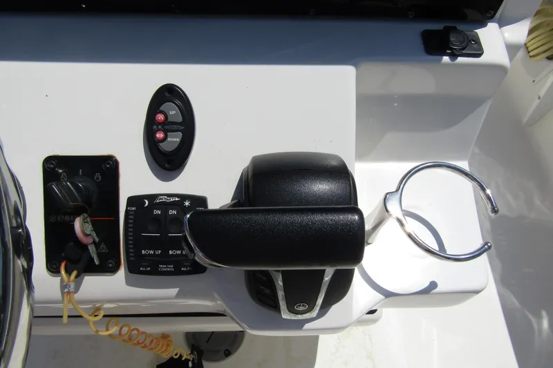Slide: The Image of Control panel of 2022 Skeeter SX2550 Fish boat with throttle and cup holder. - 25