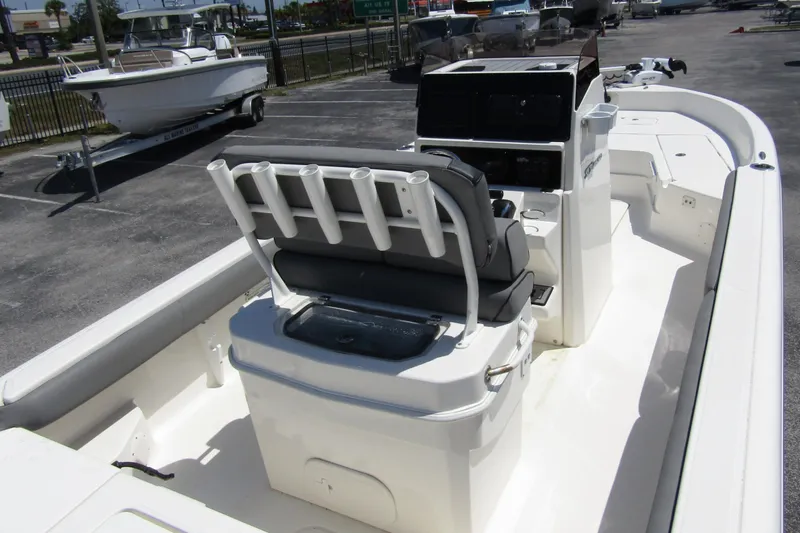 Slide: The Image of 2022 Skeeter SX2550 Fish boat interior with seating and console, parked outdoors. - 33