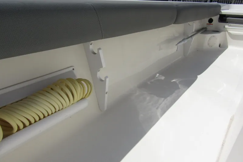 Slide: The Image of 2022 Skeeter SX2550 Fish boat interior with coiled hose storage. - 35