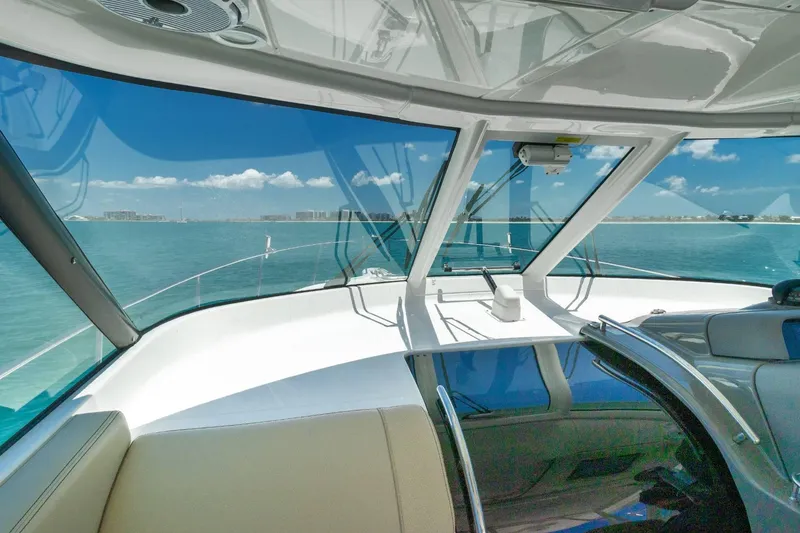 Slide: The Image of Interior view of 2019 Pursuit OS 385 Offshore yacht with ocean backdrop. - 15