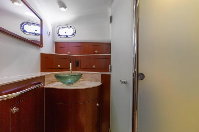 Slide: The Image of Luxurious bathroom interior of 2019 Pursuit OS 385 Offshore yacht with modern fixtures. - 36
