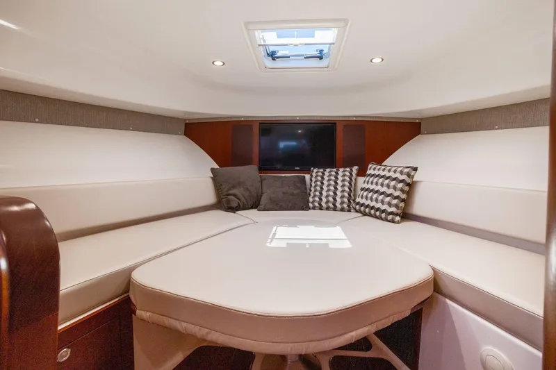 Slide: The Image of Luxurious cabin interior of 2019 Pursuit OS 385 Offshore yacht with plush seating and cushions. - 38