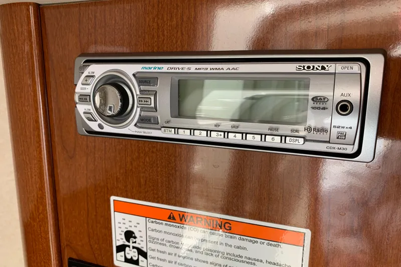Slide: The Image of Sony marine stereo system on 2012 Sea Ray 240 Sundancer boat interior panel. - 21