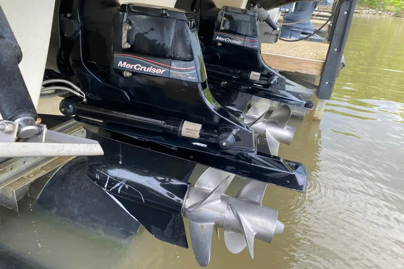Slide: The Image of Twin MerCruiser outdrives on a 2012 Chaparral 327 SSX boat in water. - 10