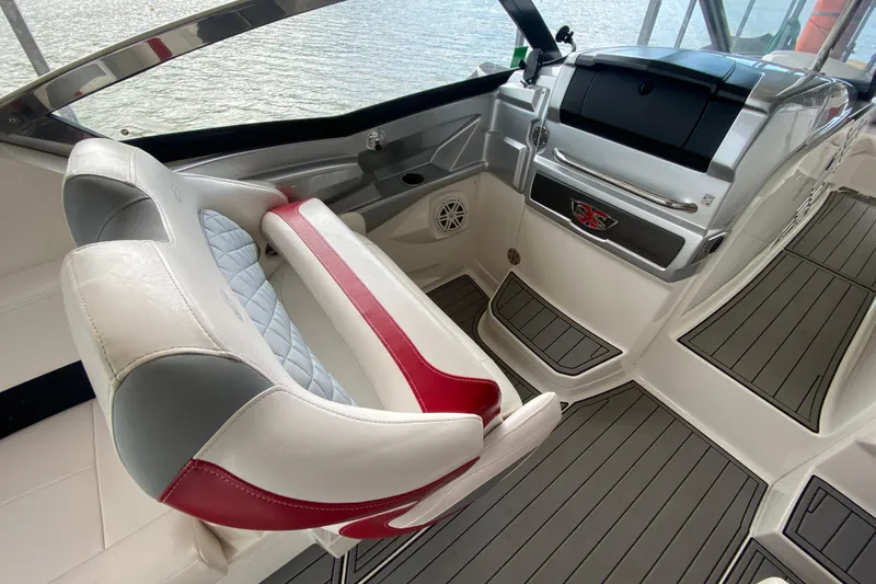 Slide: The Image of 2012 Chaparral 327 SSX boat interior with stylish seating and modern dashboard. - 24