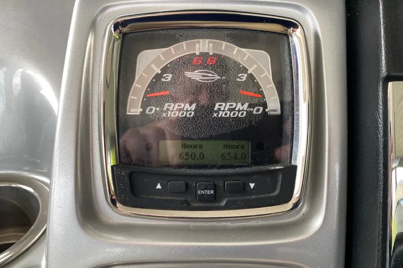 Slide: The Image of Close-up of 2012 Chaparral 327 SSX tachometer displaying RPM and engine hours. - 26
