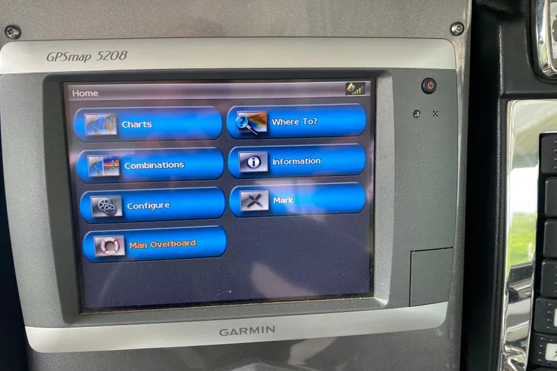 Slide: The Image of Garmin GPSmap 5208 display on 2012 Chaparral 327 SSX boat, showing navigation options. - 27