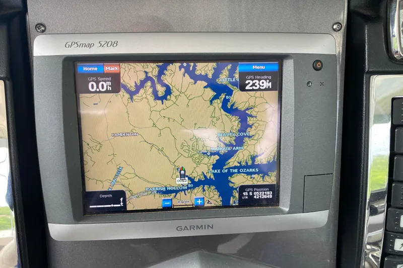 Slide: The Image of Garmin GPSmap 5208 displaying Lake of the Ozarks navigation on Chaparral 327 SSX, 2012 model. - 28